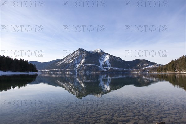 Walchensee or Lake Walchen and Herzogstand mountain in winter