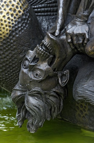 Half-decayed husband fighting with wife statue