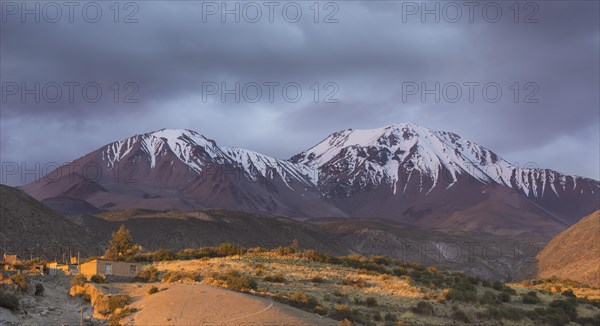 The Taapaca volcano in the last evening light