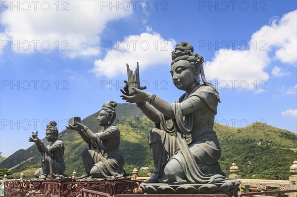 Statues of Devas making offerings at Tian Tan Buddha image at Po Lin Monastery