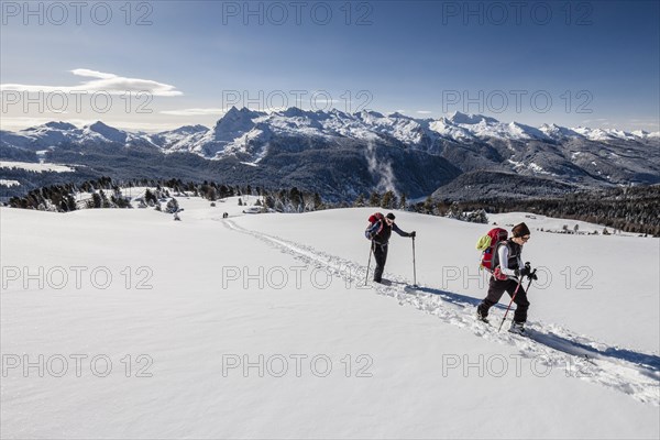 Ski touring the ascent to Cima Bocche on Passo Valles