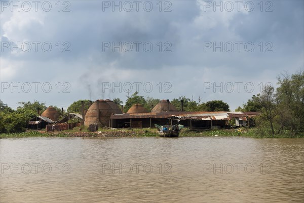 Charcoal burning in the Mekong Delta