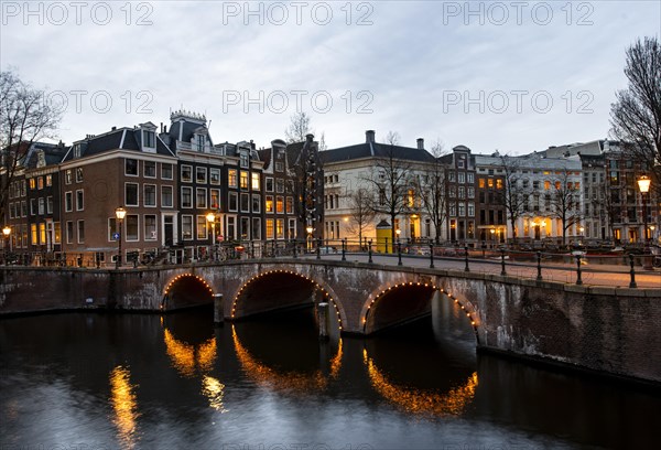 Canal with bridge at dusk