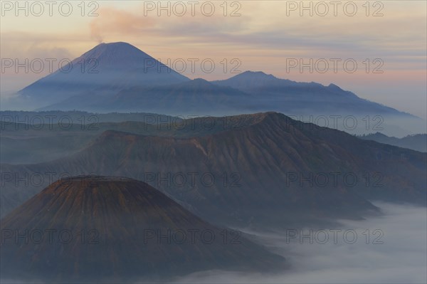 Sunrise over the smoking Gunung Bromo volcano