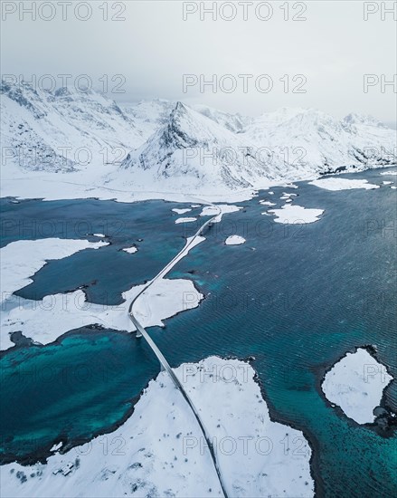 Snow-covered landscape at the fjord with Fredvang bridges