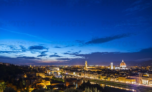 Illuminated city panorama at dusk with Florence Cathedral