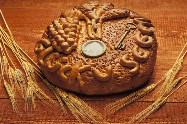 Decorated bread loaf with a key and salt shaker baked into the bread