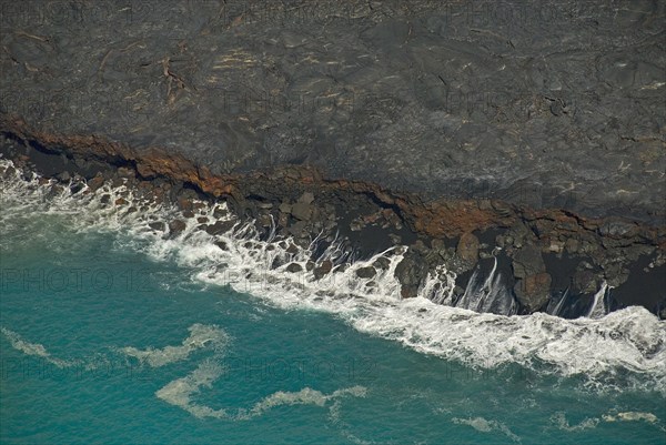 Surf at the foot of Mt Kilauea