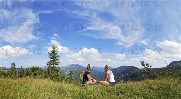 Mother and daughter resting on Weisenbachkopf mountain