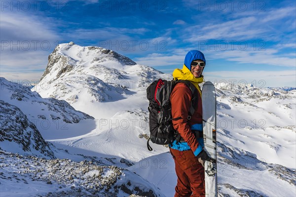 Ski mountaineer in front of the summit of Mt Hochkonig