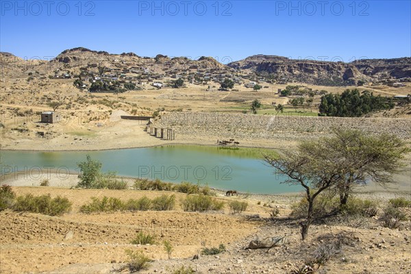 Mountain landscape along the road from Asmarra to Qohaito with a little pond