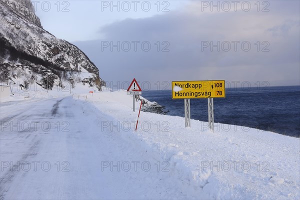 The snow-covered main road E69 on Porsangerfjord