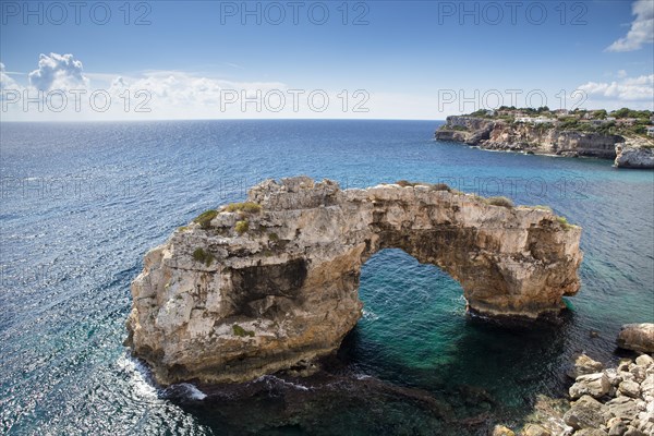 Natural stone arch in the sea