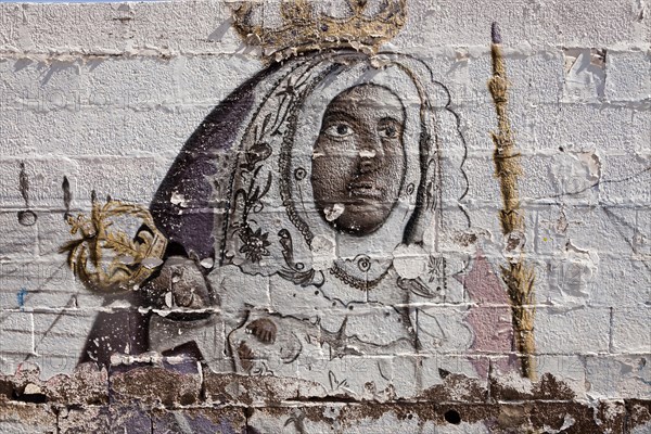 Graffiti with the patron saint of the Canary Islands Virgen de la Candelaria in the pilgrimage town of Candelaria