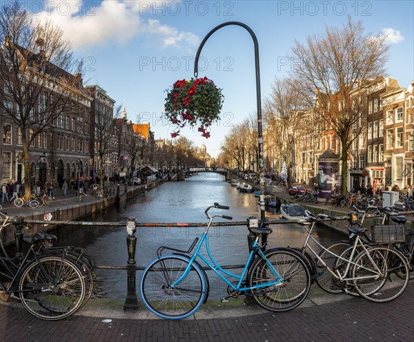 Parking bicycle on bridge over canal at Oudezijds Voorburgwal