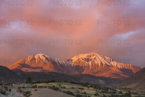 The Taapaca volcano at sunset