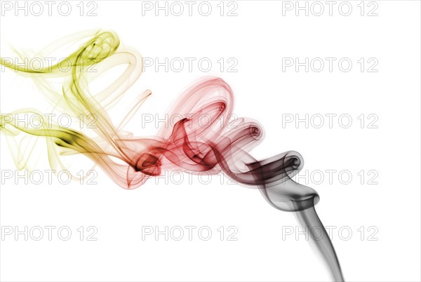 Colourful smoke from an incense stick or joss stick