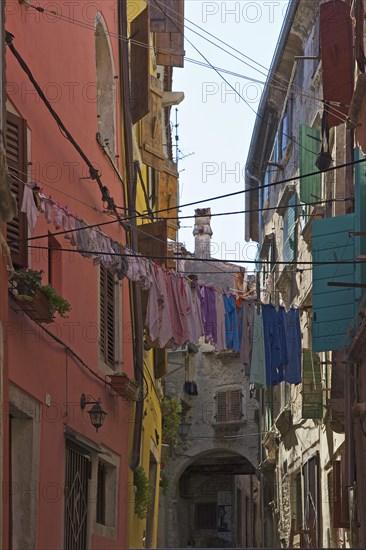 Laundry drying on the line in an alley in the old town