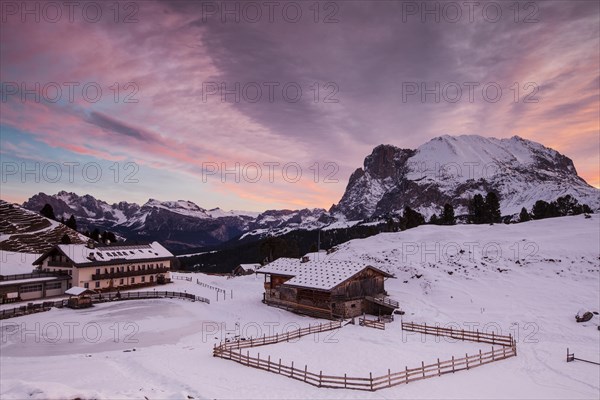 Dawn on Plattkofel and Mahlknechthutte hut in winter