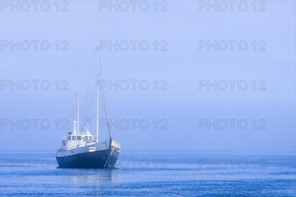 Sailing boat with fog