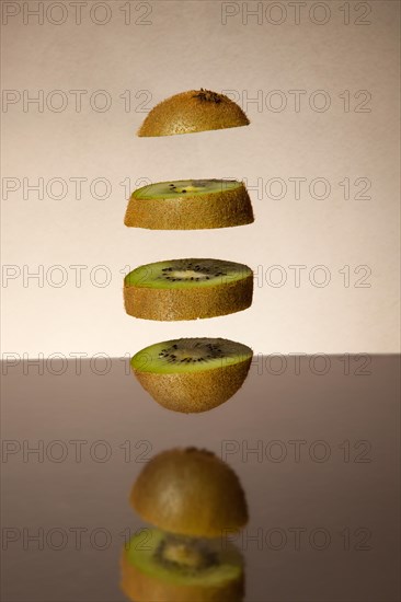 Falling kiwi slices