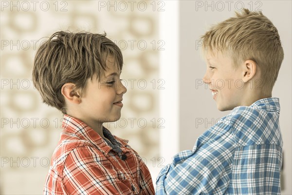 Two boys in plaid shirts