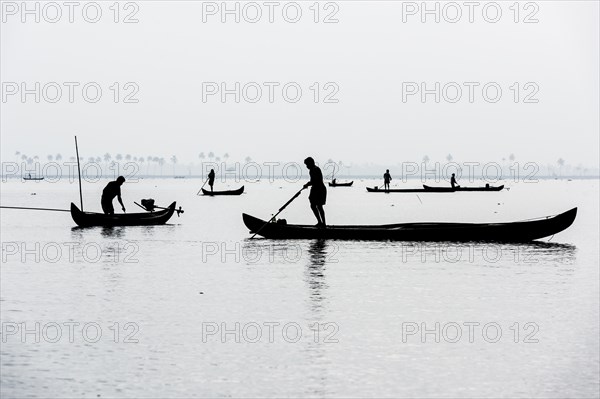 Cockle pickers with their boats