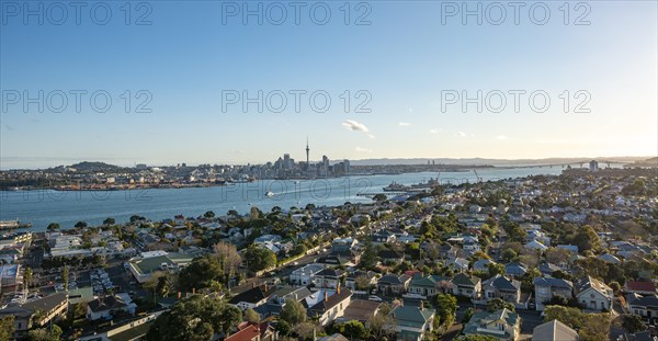View over the houses of Devonport to the skyline of Auckland with Sky Tower