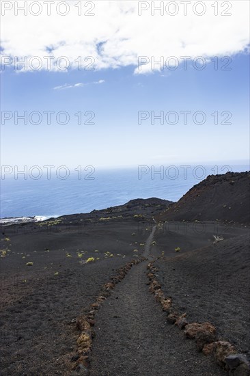 Hiking trail through lava landscape