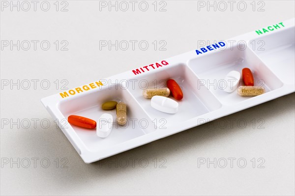 Tablet dispenser filled with pills for the whole day