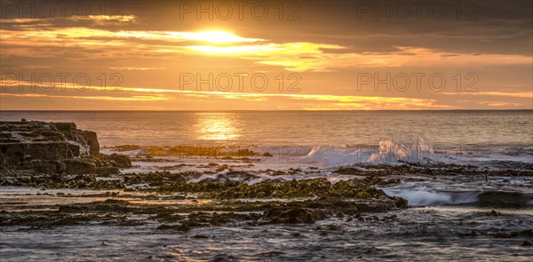 Landscape with sunset on the rocky coast