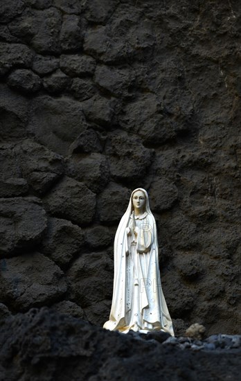 Madonna figure in volcanic rock