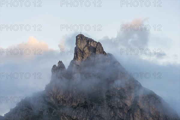 Mount Sass de Stria in the clouds at sunrise