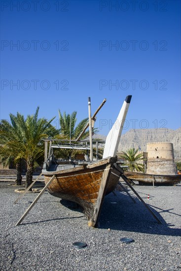 Old dhow in front of Khasab fort