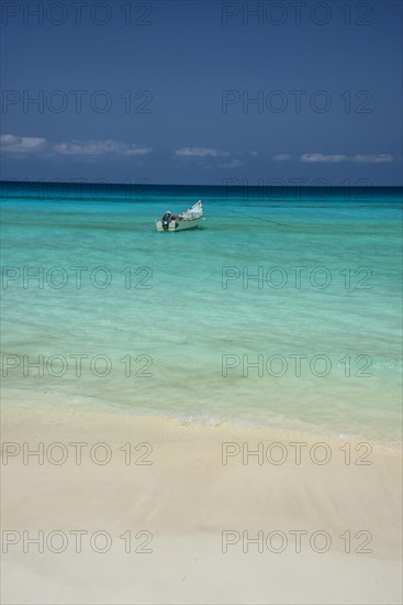 Fishing boat in the turquoise waters in Shuab Bay