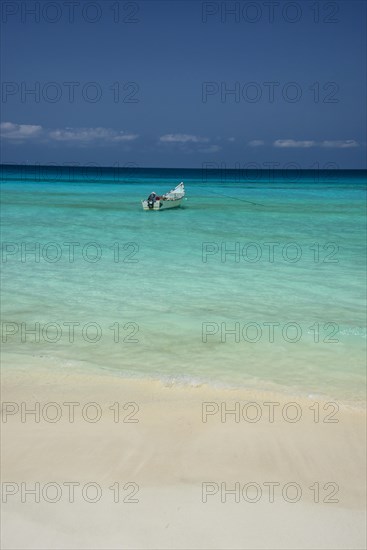 Fishing boat in the turquoise waters in Shuab Bay