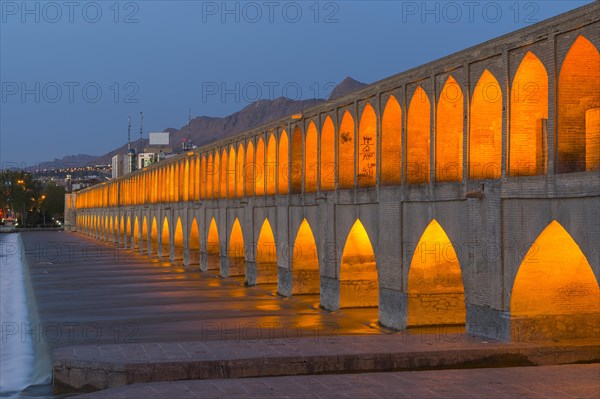 Illuminated Si-o-se Pol Bridge or Allah-Verdi Khan Bridge at dusk