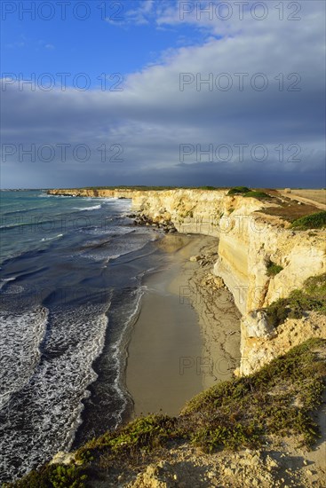 Cliffs in the evening light with rain clouds