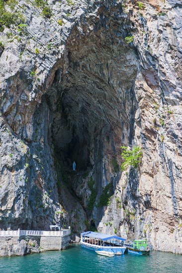 Small tourist boat in a cave on Koman reservoir