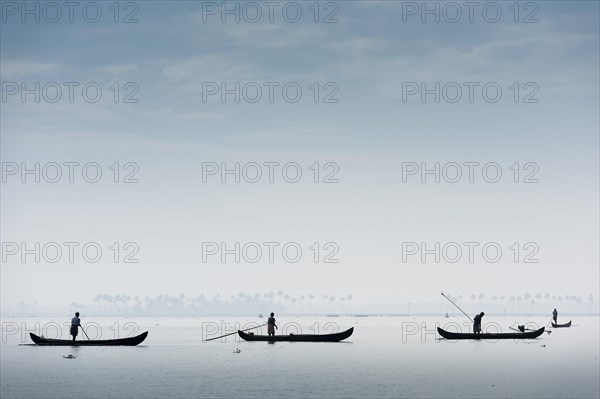 Cockle pickers with their boats