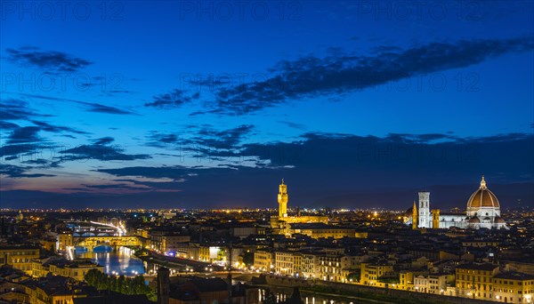 Illuminated city panorama at dusk with Florence Cathedral