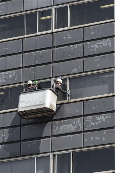 Two window cleaners at a skyscraper