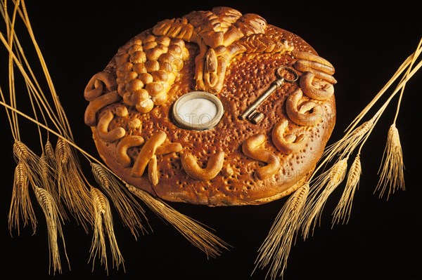 Decorated bread loaf with a key and salt shaker baked into the bread