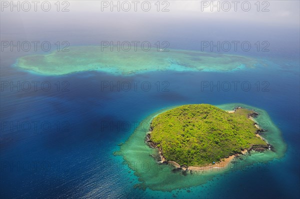 Uninhabited island with coral reef