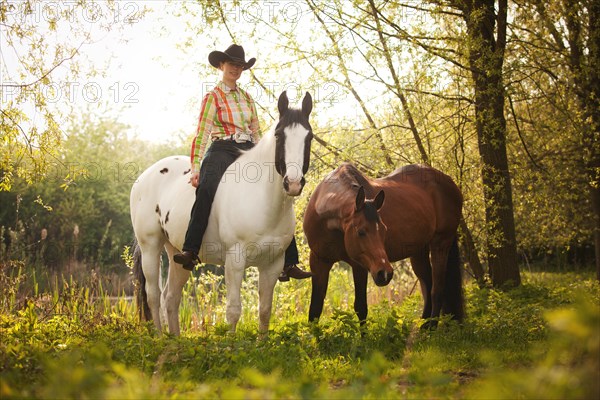 Female western rider on a Paint Horse