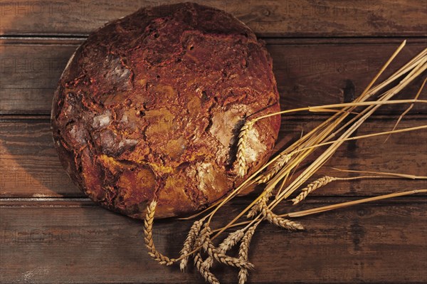 Freshly baked farmhouse bread with wheat ears