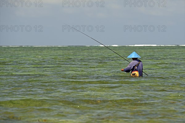 Fisherman standing in the water