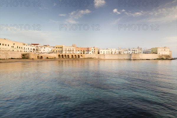 Town beach and historic centre in the evening light