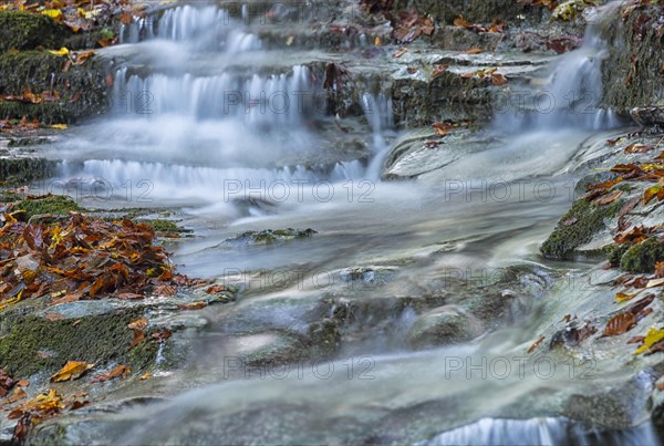 Waterfall in the forest in autumn