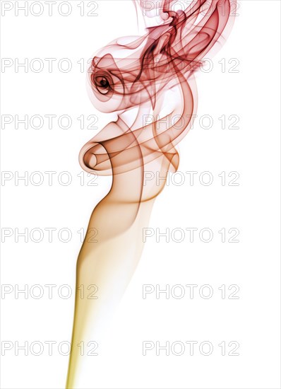 Colourful smoke from an incense stick or joss stick